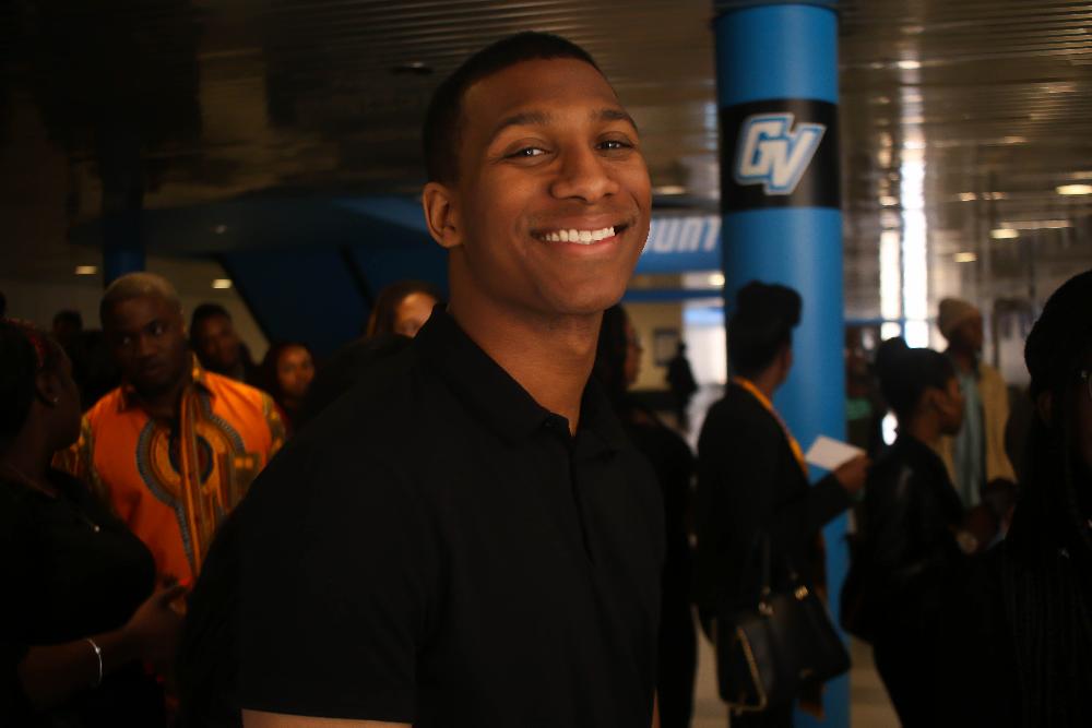 Black male graduate smiling
